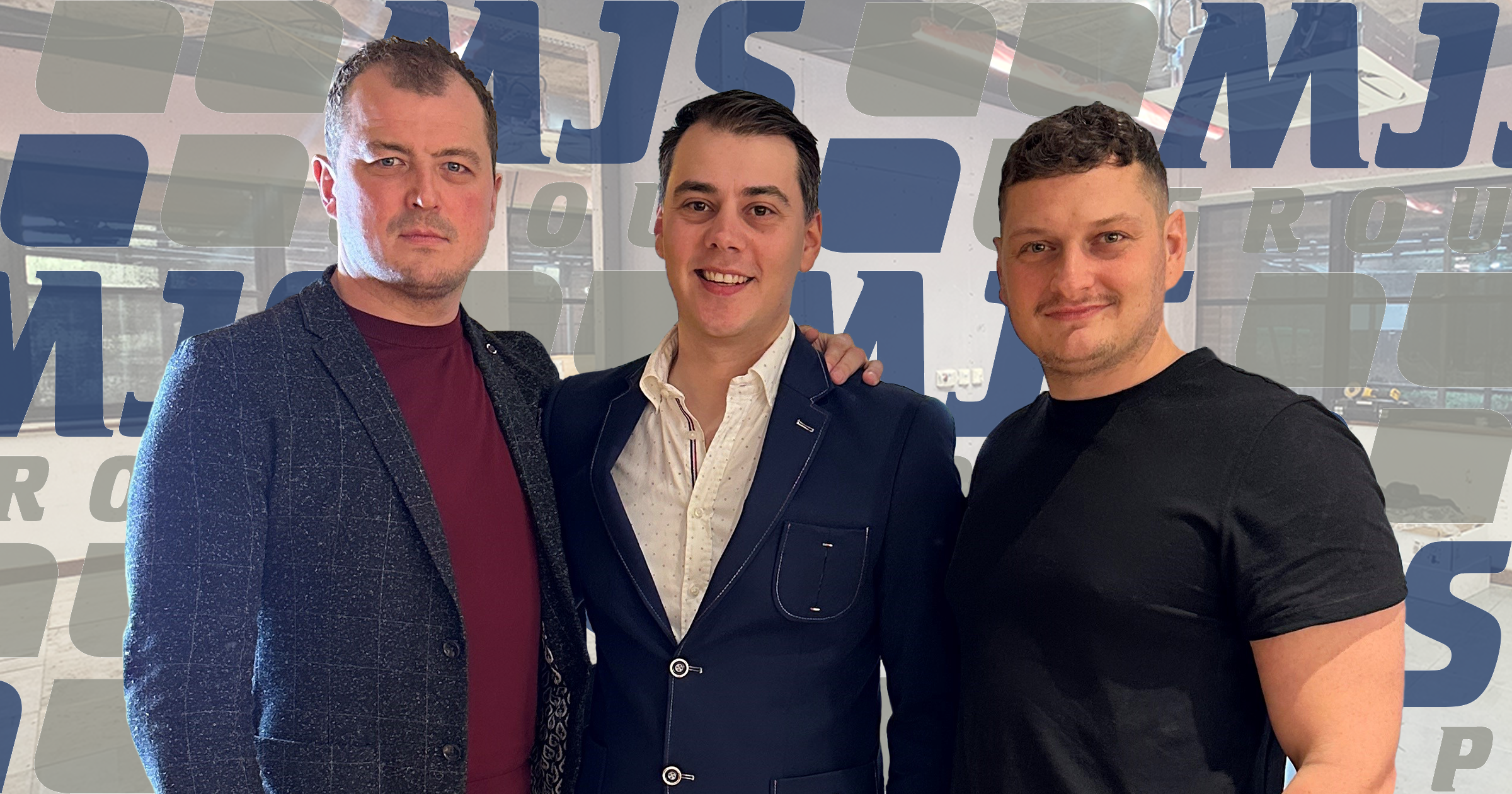 MJS Group management team Ian ‘Macca’ MacDonald, Louis Greenaway, Liam Taylor stand in front of a logo backdrop